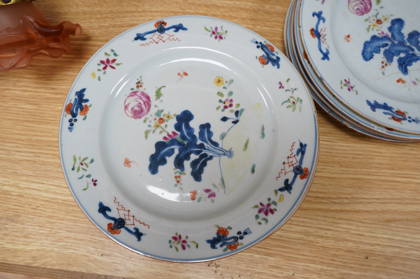 A set of eleven Chinese porcelain ‘’tobacco leaf’’ dishes, (3 cracked), 23cm diameter. Condition - poor.